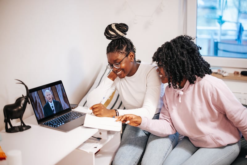 A family in Munich, Germany, participates in a session of general conference.