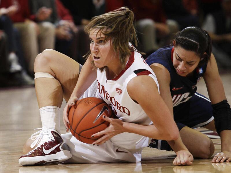 Stanford guard Jeanette Pohlen (23) gets the ball away from Connecticut guard Bria Hartley (14) in the first half of an NCAA college basketball game in Stanford, Calif., Thursday, Dec. 30, 2010.