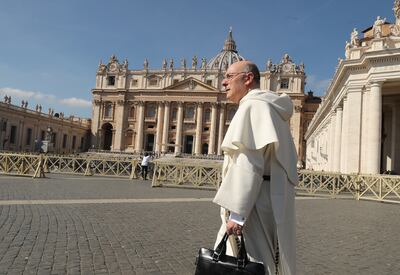 A priest walks near the Vatican in Rome, Italy, on Saturday, March 9, 2019.