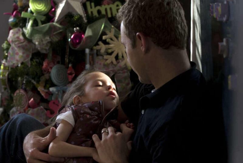 Eliza Williams and her father Callahan sit in Eliza's bedroom with her Christmas tree at their Bountiful home on December 18, 2009.