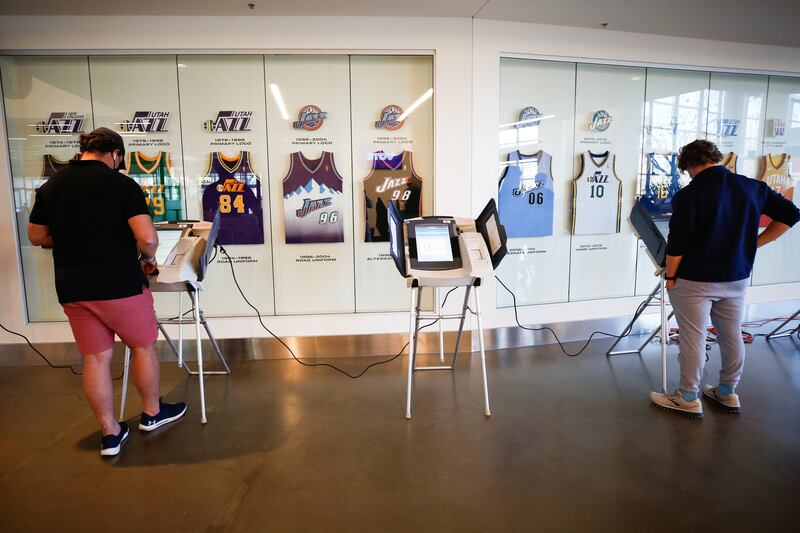 Voters complete the ballot on the voting machines during the Election Day voting at Vivint Smart Home Arena in Salt Lake City on Tuesday, Nov. 3, 2020.