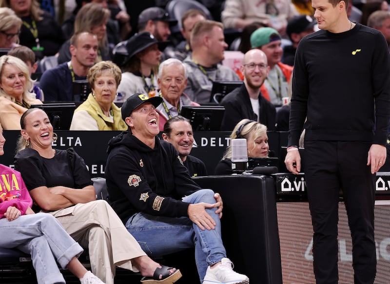 Jazz owners Ryan and Ashley Smith laugh at something head coach Will Hardy said during Jazz-Nuggets game.