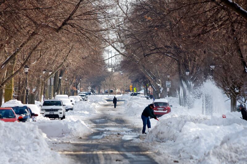 A person clears snow in Buffalo, N.Y.