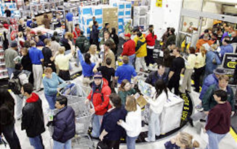 Shoppers pour into Best Buy at 6 a.m. Friday, eager to find “Black Friday” bargains.
