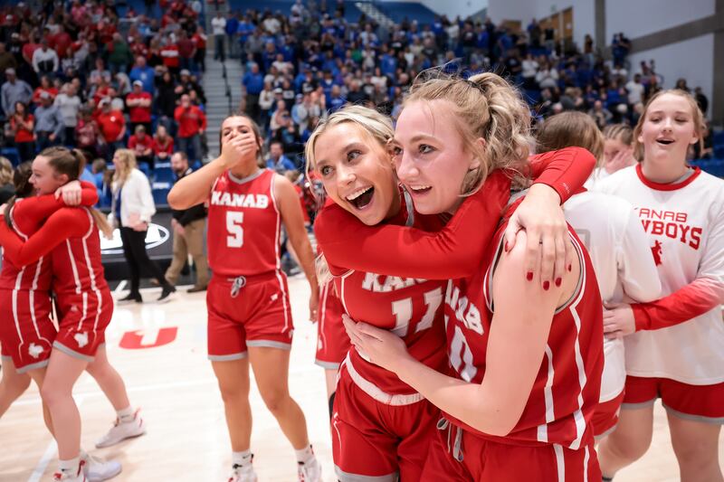 Kanab’s Emilie Gilberg and Taylor Janes celebrate their team’s 2A state championship win.