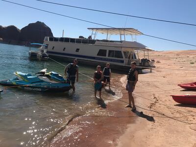 From left, Sherry Young's son Tom gets ready to take a Sea-Doo out with son Jake while cousins Cyrus and Asher wait for a ride.
