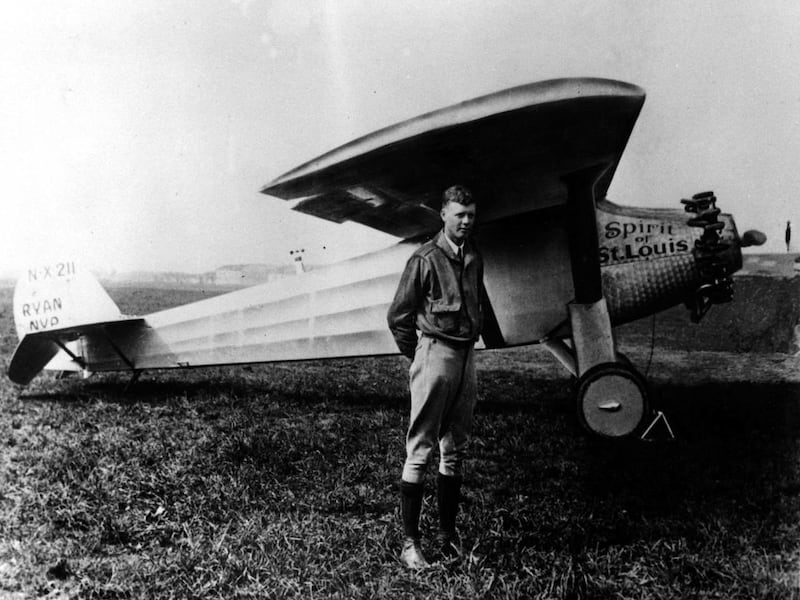 Charles A. Lindbergh is shown in this 1927 file photo with his plane, the Spirit of St. Louis, with which he made the first solo crossing of the atlantic from west to east, the same year.