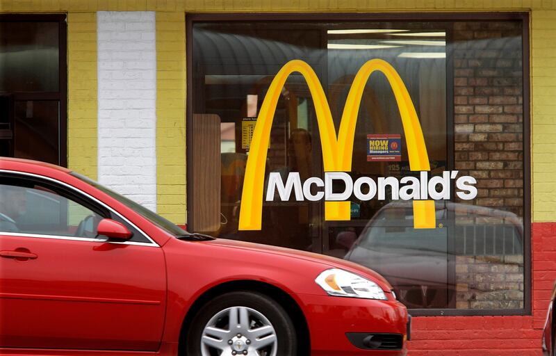 In this Oct. 17, 2011, file photo, cars move through the drive-thru window at a McDonald’s in Springfield, Ill.