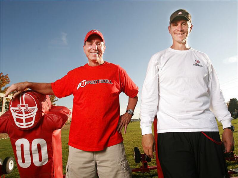 Defensive coordinator Gary Andersen, right, and his brother Mark both work on the University of Utah football staff. The two began working together when Gary became head coach at Southern Utah.