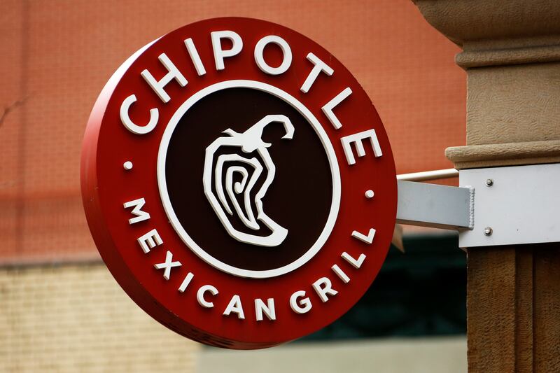 This 2017 photo displays a Chipotle restaurant sign hanging in Pittsburgh, Pa.