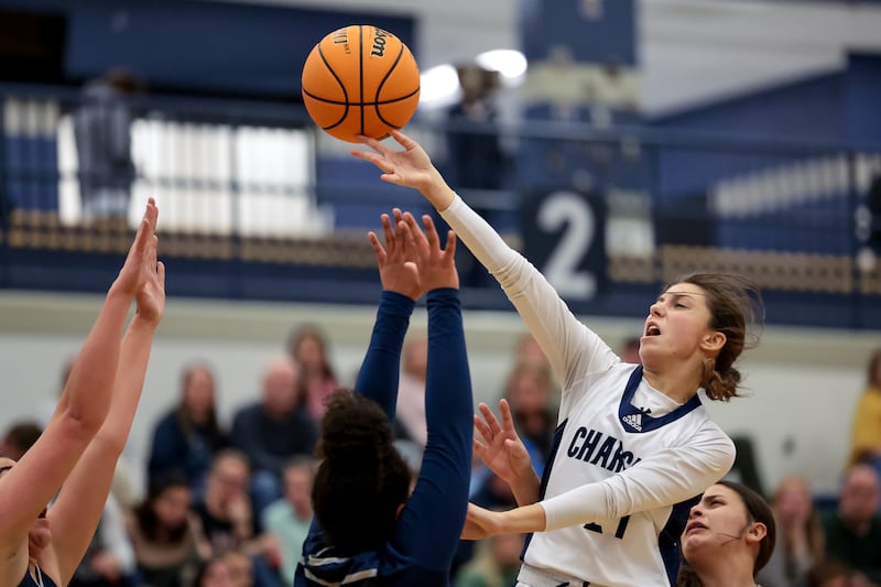 Corner Canyon’s Maia Rhay scores over Hunter’s defense in a high school girls basketball game in Draper.