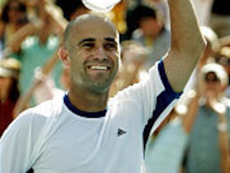 Andre Agassi reacts after winning his men's semifinal match against Robby Ginepri, again needing five sets.