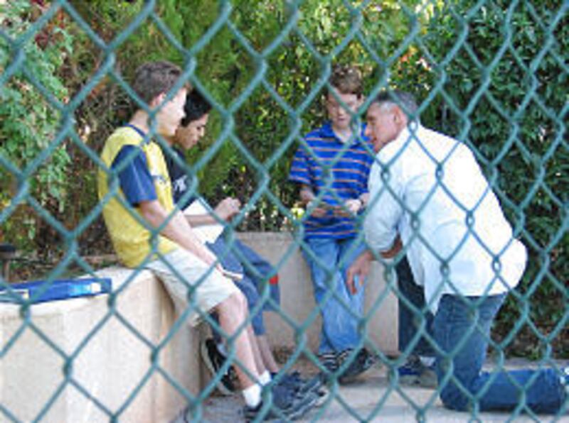 Eric Hendershot directs actors on the set of "Down and Derby," a movie focusing on the Pinewood Derby.
