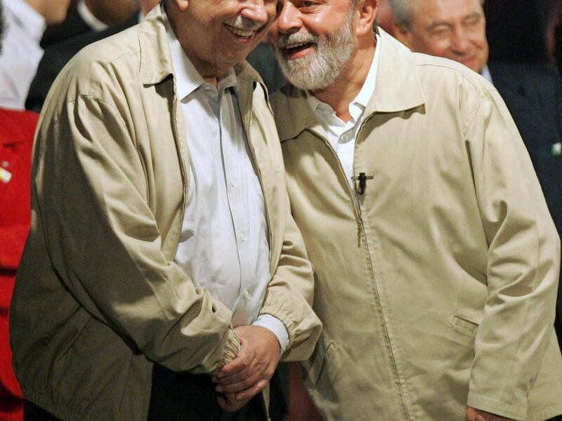 FILE - In this Aug 11, 2006 file photo, Brazil's President Luiz Inacio Lula da Silva, right, talks with his Vice President Jose Alencar during a campaign rally in Rio de Janeiro, Brazil. Brazil's former vice president, Jose Alencar, died Tuesday March 29
