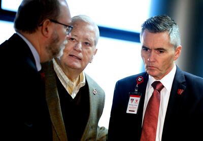 Daniel Reed, Senior Vice President of Academic Affairs at the University of Utah, left, H. David Burton, board of trustees at the university, and Michael Good, Senior Vice President for Health Sciences at the university, talk after a press conference abou