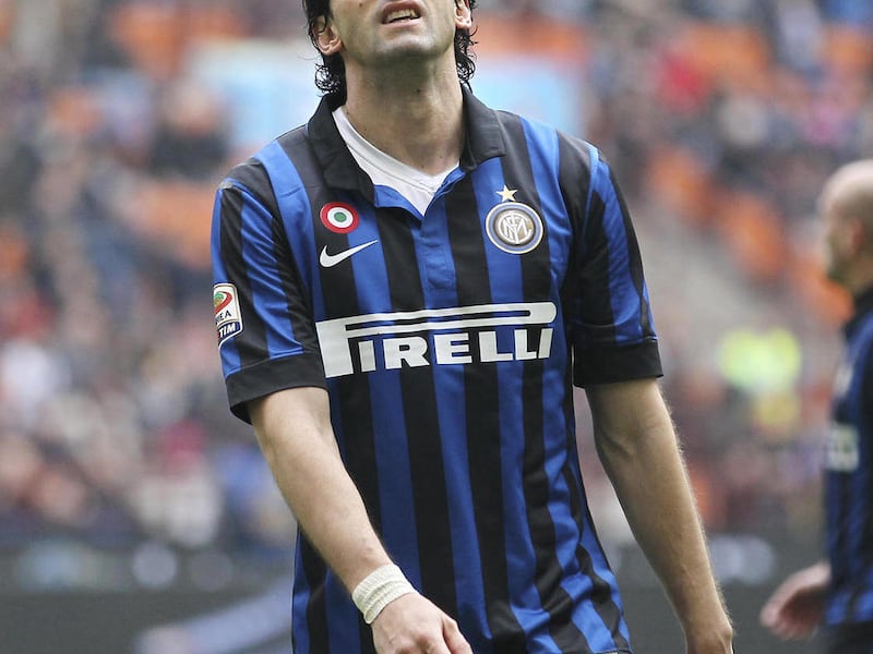 Inter Milan Argentine forward Diego Milito reacts after missing a penalty kick chance during the Serie A soccer match between Inter Milan and Atalanta at the San Siro stadium in Milan, Italy, Sunday, March 18, 2012.