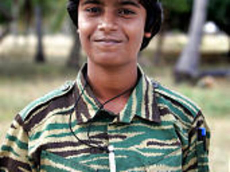 A Tamil Tiger rebel shows her cyanide capsule at an undisclosed location in northern Sri Lanka Wednesday. Fighters swallow the pill when captured.