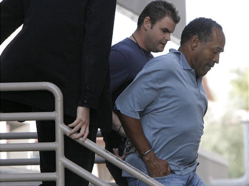 O.J. Simpson, being transferred tot he Clark County Detention Center in Las Vegas on Sunday, was charged Tuesday with seven felonies, including kidnapping, in the alleged armed robbery of sports memorabilia collectors in a casino-hotel room. Simpson, who
