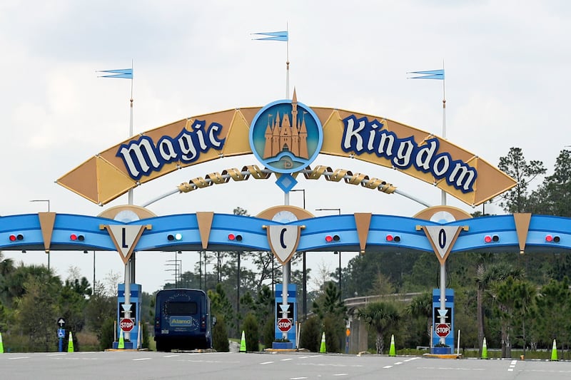 In this March 16, 2020, file photo, the entrance to the parking lot at the Magic Kingdom at Walt Disney World is closed in Lake Buena Vista, Fla.