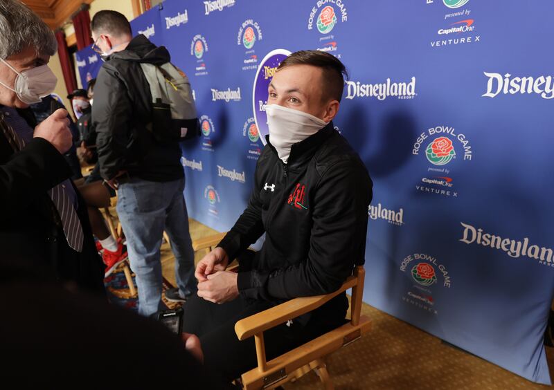Utah Utes wide receiver Britain Covey, wearing a mask, speaks to a reporter during a press conference at Disneyland