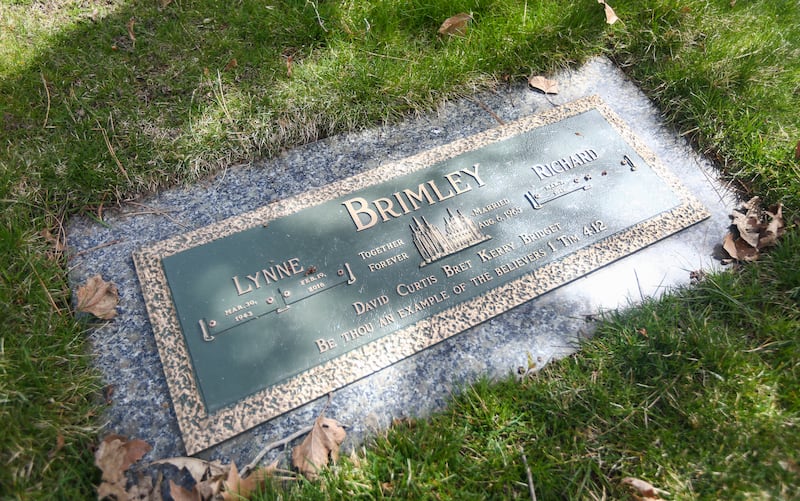 The grave site of Lynne Brimley, a mother of five and grandmother of 20, who went to Portica Body & Face for liposuction in 2016 and 24 hours later was dead, at Mountain View Memorial Estates Cemetery in Salt Lake City on Friday, April 5, 2019.