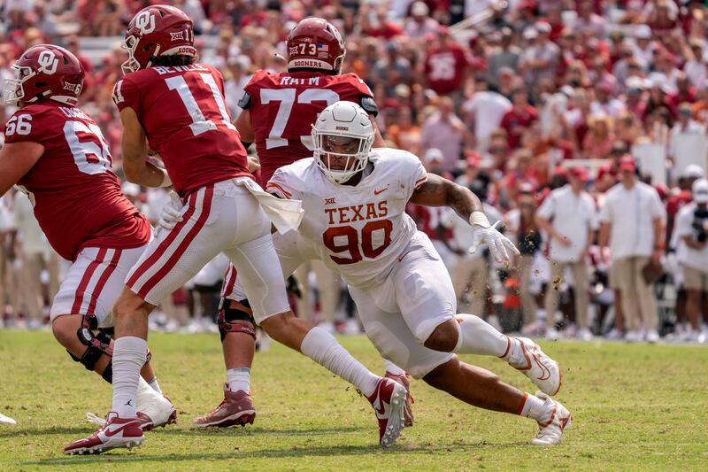 Texas and Oklahoma battle during a college football game, Oct. 8, 2022. The two schools will leave the Big 12 Conference in 2025.