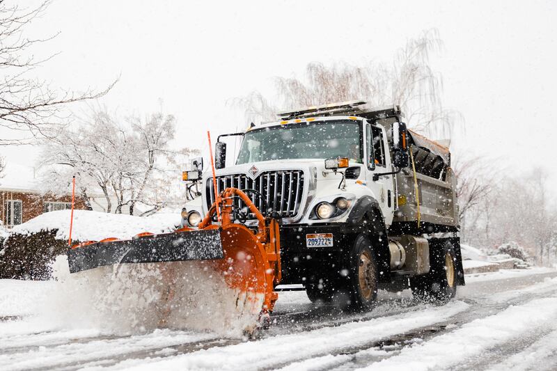 A snowplow clears the roads after a snowstorm in Salt Lake City on March 24, 2023. Utah has achieved a record-breaking snowfall total this winter and snowplows have been vital in keeping traffic moving.