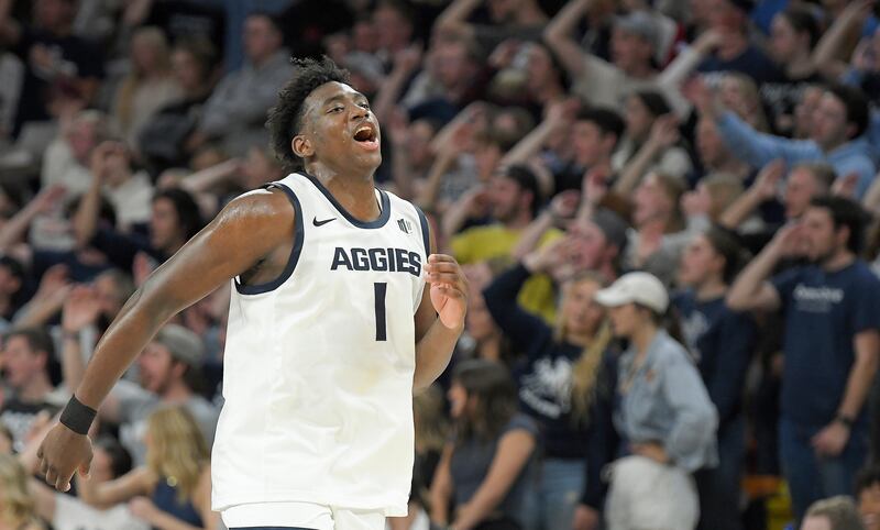Utah State forward Great Osobor chants “air ball” with the student section after Southern Utah missed a shot during the second half of an NCAA college basketball game Tuesday, Nov. 14, 2023, in Logan, Utah. (Eli Lucero/The Herald Journal via AP)