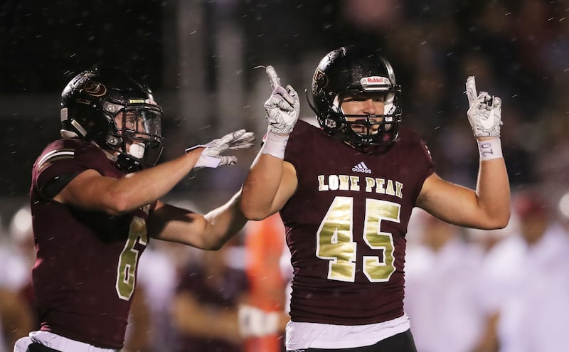 Lone Peak's Michael Daley celebrates after a tackle as Lone Peak and Herriman open the 2018-19 football season at Lone Peak on Friday, Aug. 17, 2018.