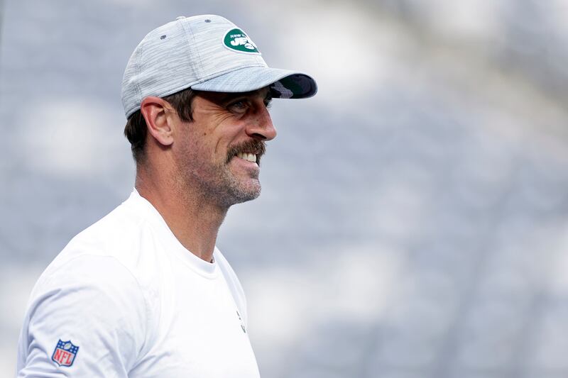 New York Jets quarterback Aaron Rodgers (8) warms up before a preseason NFL football game against the Tampa Bay Buccaneers.
