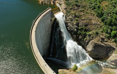 Water flows over the spillway at the East Canyon Dam on Tuesday, June 11, 2019. Utah reservoirs are full or near full for the first time in years.