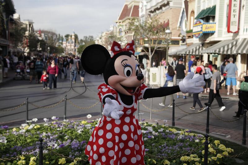 Minnie Mouse entertains visitors at Disneyland, Thursday, Jan. 22, 2015, in Anaheim, Calif.