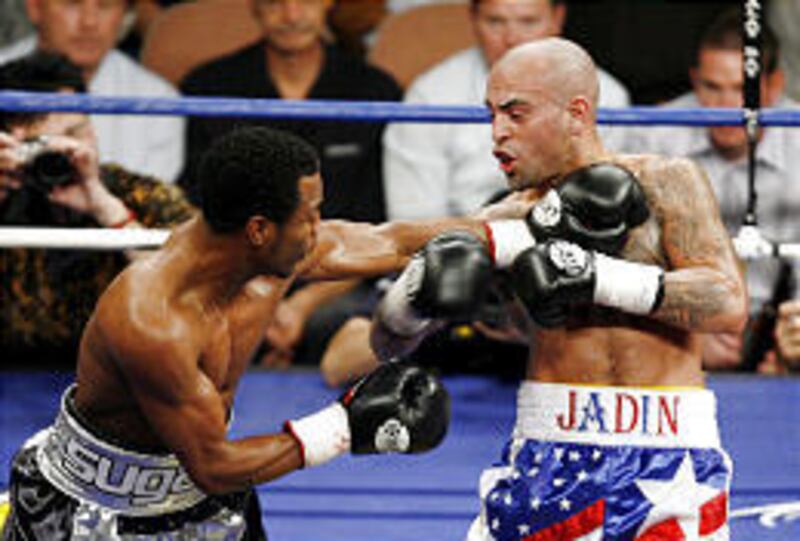 Shane Mosley, left, punches Luis Collazo during their interim WBC welterweight championship match in Las Vegas on Saturday.