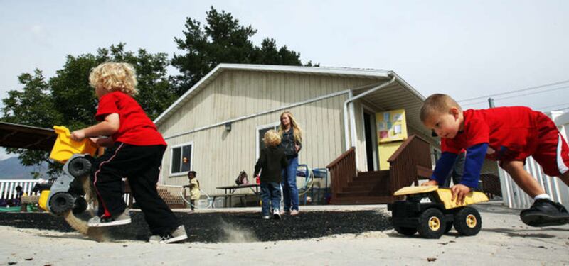 Jason Matterfis and Vladik Talker race trucks at the Wee Care Center at Utah Valley University.