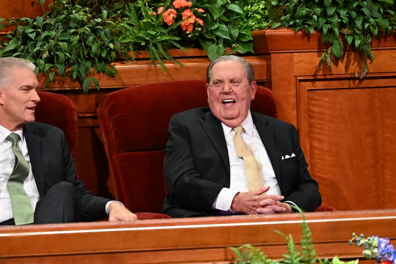 President Jeffrey R. Holland, acting president of the Quorum of the Twelve Apostles, right, talks with Elder Brian K. Taylor, a General Authority Seventy and president of the Church’s Utah Area, before the closing devotional of the 2025 Utah Area Young Single Adult Conference, held in the Conference Center in Salt Lake City on Sunday, Aug. 31, 2025.