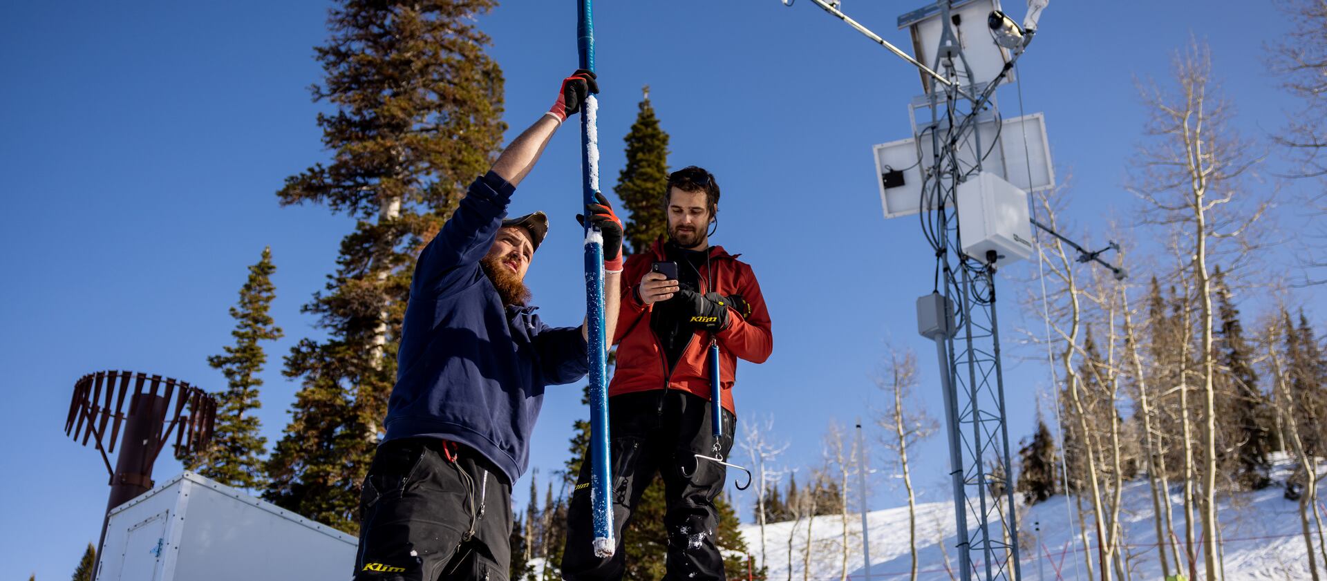 Justin Byington and Dave Eiriksson, both hydrologists for the Utah Snow Survey, demonstrate how they take snow core samples during a media tour of the Utah Snow Survey’s Powder Mountain SNOTEL Site at the ski resort in Eden.