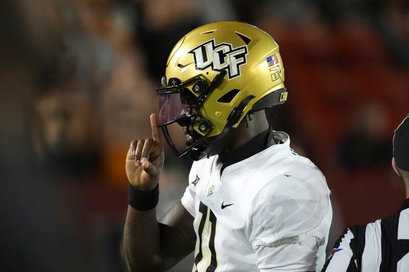 Central Florida quarterback Jacurri Brown reacts to the fans as he runs in a touchdown during against Iowa State, Saturday, Oct. 19, 2024, in Ames, Iowa. The Knights host No. 11 BYU Saturday in Orlando.