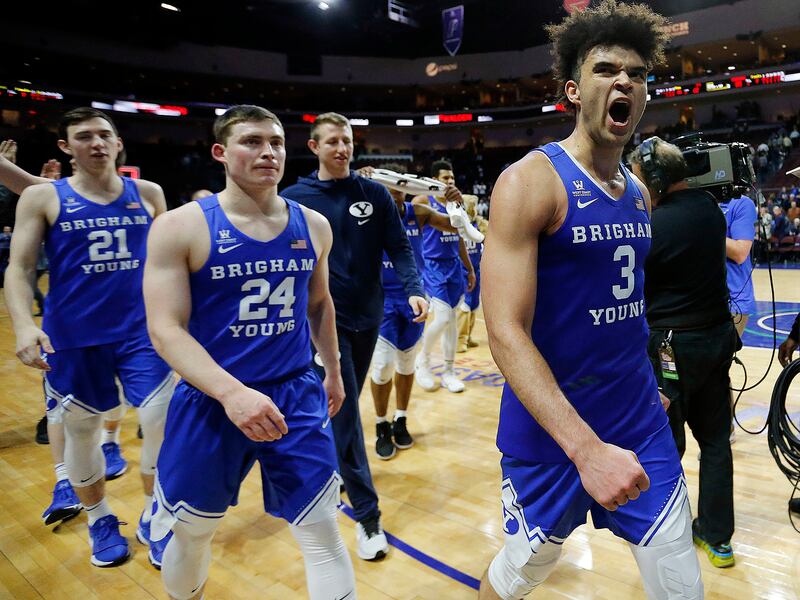 Brigham Young Cougars guard Elijah Bryant, right, celebrates after BYU defeats the St. Mary's Gaels during the West Coast Conference basketball tournament in Las Vegas on Monday, March 5, 2018.