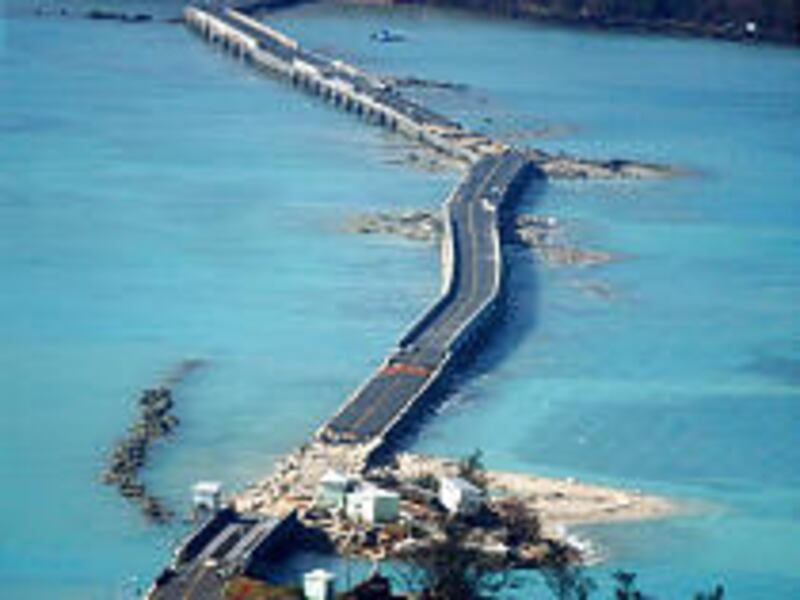 The hurricane's 120-mph winds damaged the causeway leading to Bermuda's International Airport. Four people are missing from the storm.