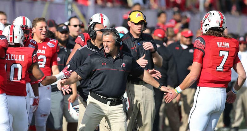 Utah Utes head coach Kyle Whittingham congratulates players as the University of Utah plays Colorado State in NCAA football at the Royal Purple Las Vegas Bow. Saturday, Dec. 20, 2014, in Las Vegas.