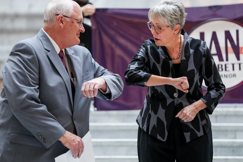 Republican gubernatorial candidate Jan Garbett, right, elbow-bumps Dr. Joseph Jarvis as she introduces him as her running mate at the state Capitol in Salt Lake City on Thursday, March 19, 2020.