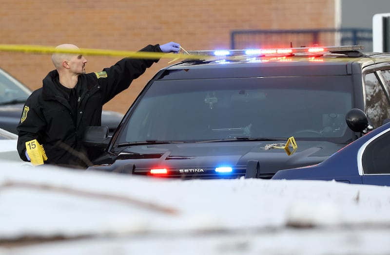 A Davis County Sheriff employee works at the scene of a shooting in Farmington on Wednesday, March 1, 2023.