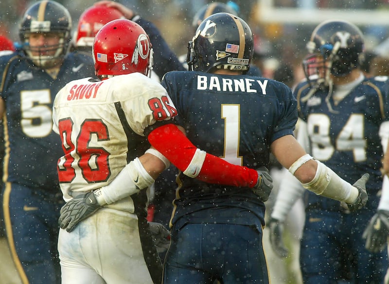Utah's Steve Savoy and BYU's Chad Barney congratulate each other after the BYU Utah football game in Provo. Utah won 3-0. BYU vs. Utah football. Nov. 22, 2003. Photo by Stuart Johnson (Submission date: 11/22/2003)
