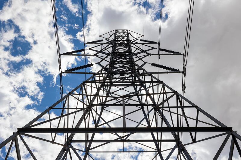 High-tension power lines run along Mountain View Corridor on the west side of the Salt Lake Valley on May 24, 2022.