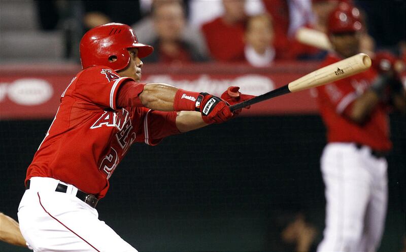 Los Angeles Angels' Alexi Amarista watches his two-run double against the Oakland Athletics during the second inning of a baseball game in Anaheim, Calif., Tuesday, April 26, 2011.