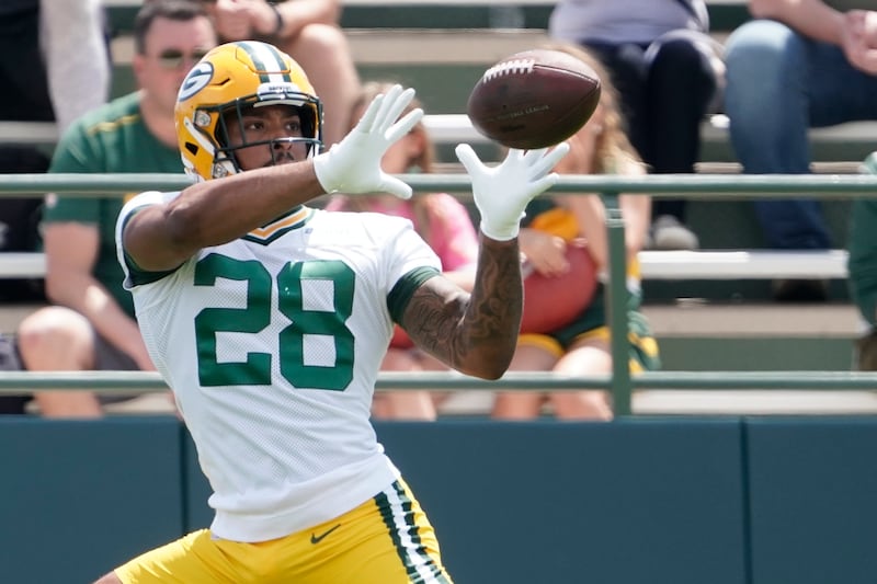 Green Bay Packers’ AJ Dillon runs a drill at his team’s practice field Tuesday, June 7, 2022, in Green Bay, Wis.