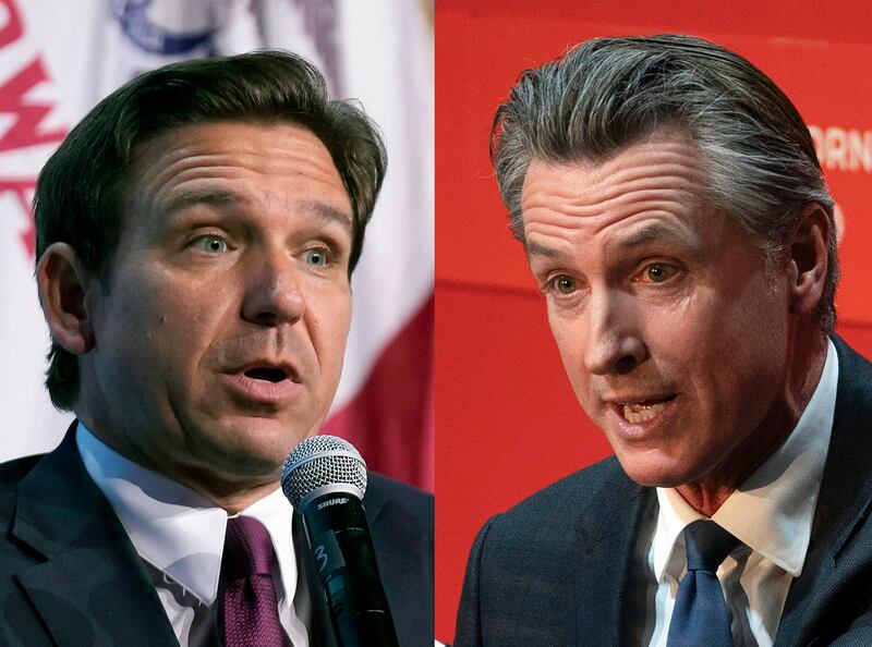 In this combination of photos, Florida Gov. Ron DeSantis speaks in Des Moines, Iowa, at left, and California Gov. Gavin Newsom, right, speaks in Sacramento, Calif.