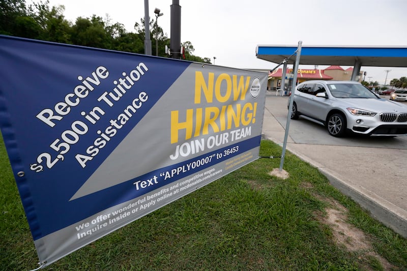 This June 21, 2019, photo shows a "now hiring" sign at a McDonald's restaurant in Moss Point, Miss. Job density is increasing in cities. Here's why a new way of measuring it can create better situations for cities and workers.