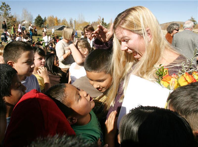 McPolin Elementary School reading specialist Melissa Bott hugs her students after receiving the Milken teaching award Tuesday in Park City.