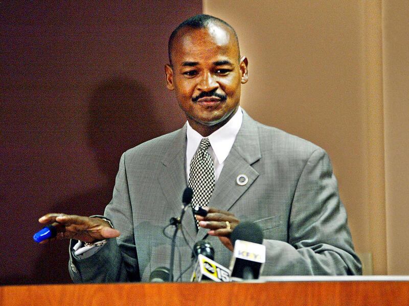 FILE - In this March 30, 2004, file photo, Don Logan, director of Scottsdsale's Diversity and Dialogue Office, speaks at a news conference , at the Human Resources Complex in Scottsdale, Ariz., after Logan returning to work a month after a package bomb ex